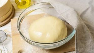 Grease the dough-